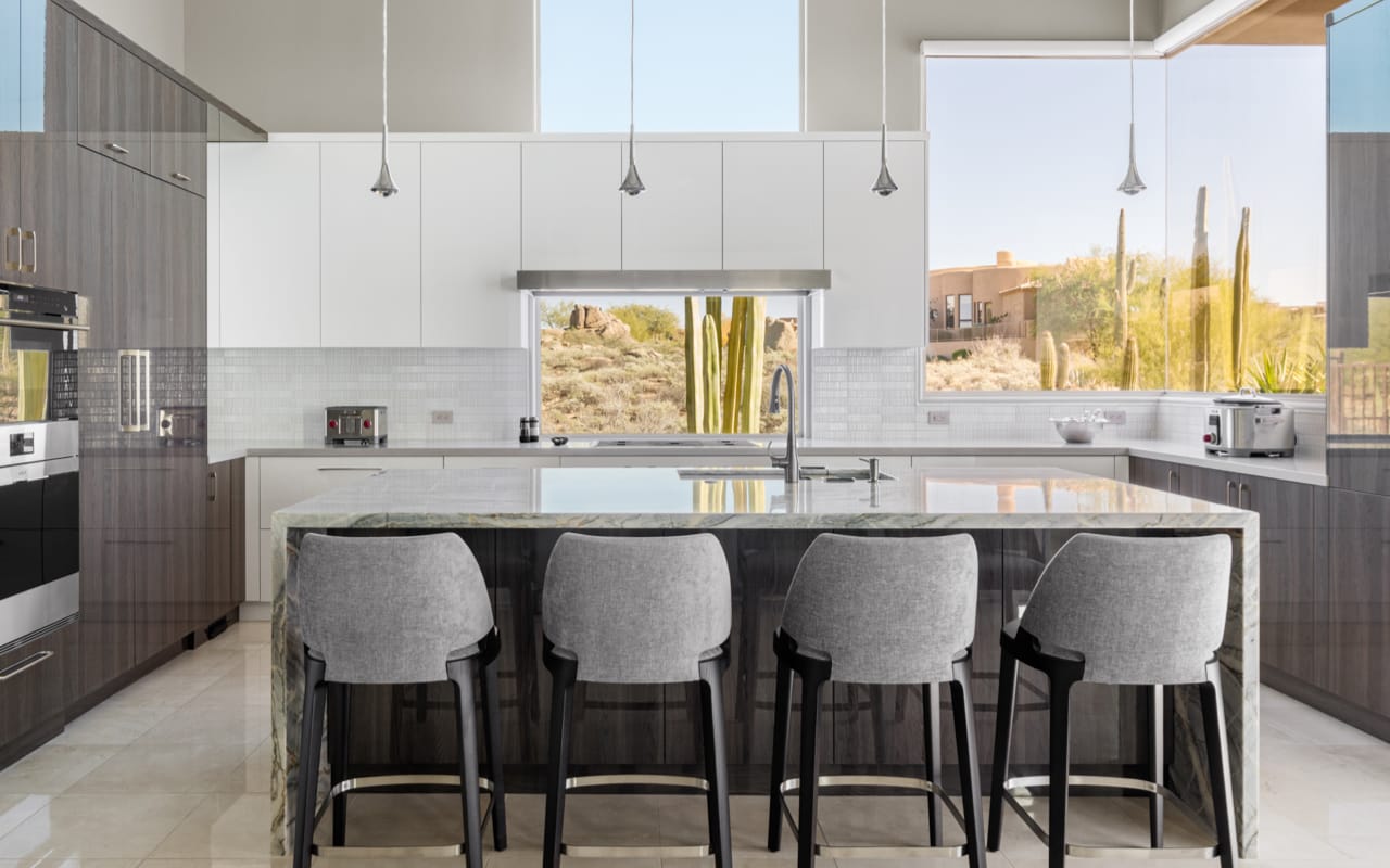 Modern contemporary kitchen with white and grey cabinetry and a center island.